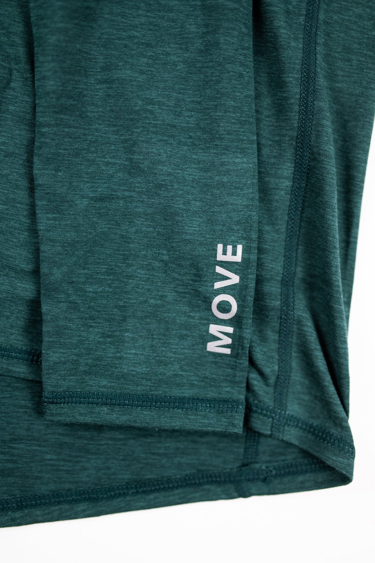 Close view of the cuff and MOVE lettering on the MOVE Sport Apparel Women’s Essential Quarter Zip in Pine Grove.
