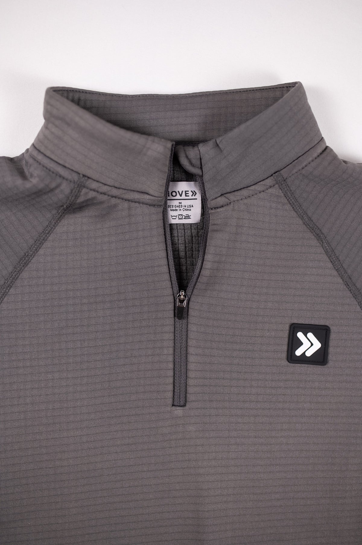 MOVE sport apparel charcoal grey waffle-knit quarter-zip pullover with raglan sleeves and chest logo patch