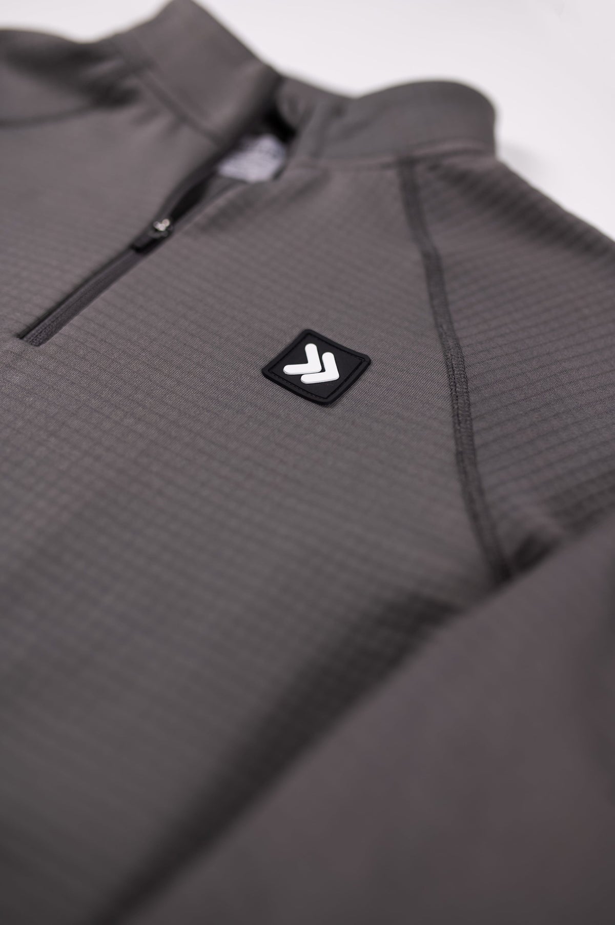 MOVE sport apparel charcoal grey waffle-knit quarter zip pullover with raglan sleeves and branded chest patch