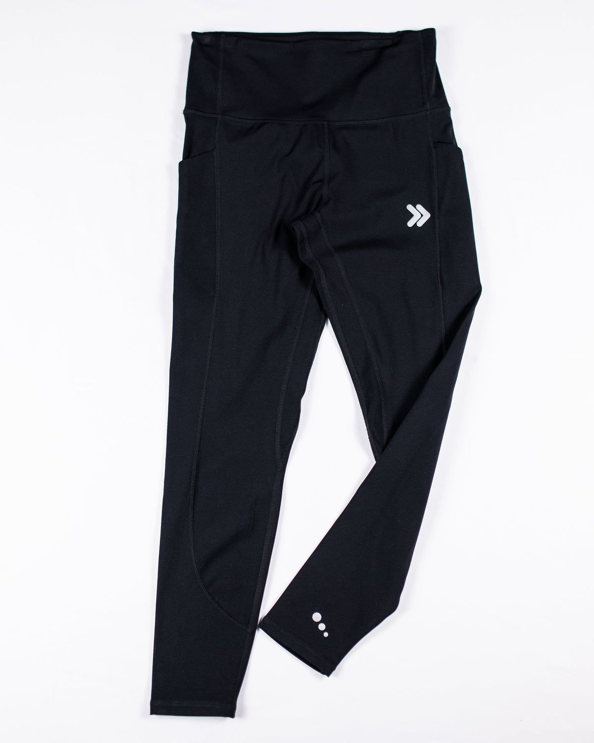 MOVE Sport Apparel women’s Brushed Running Leggings in black shown flat, with original thigh chevrons and ankle dots.