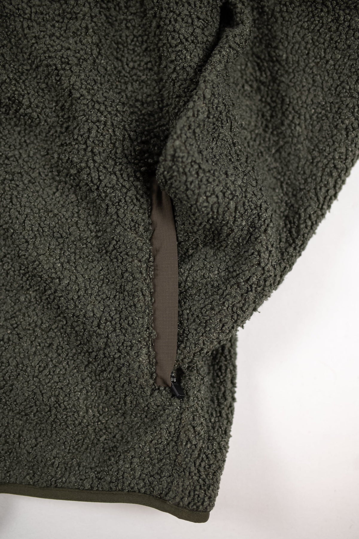MOVE sport apparel women's olive green sherpa jacket featuring a durable zippered pocket detail