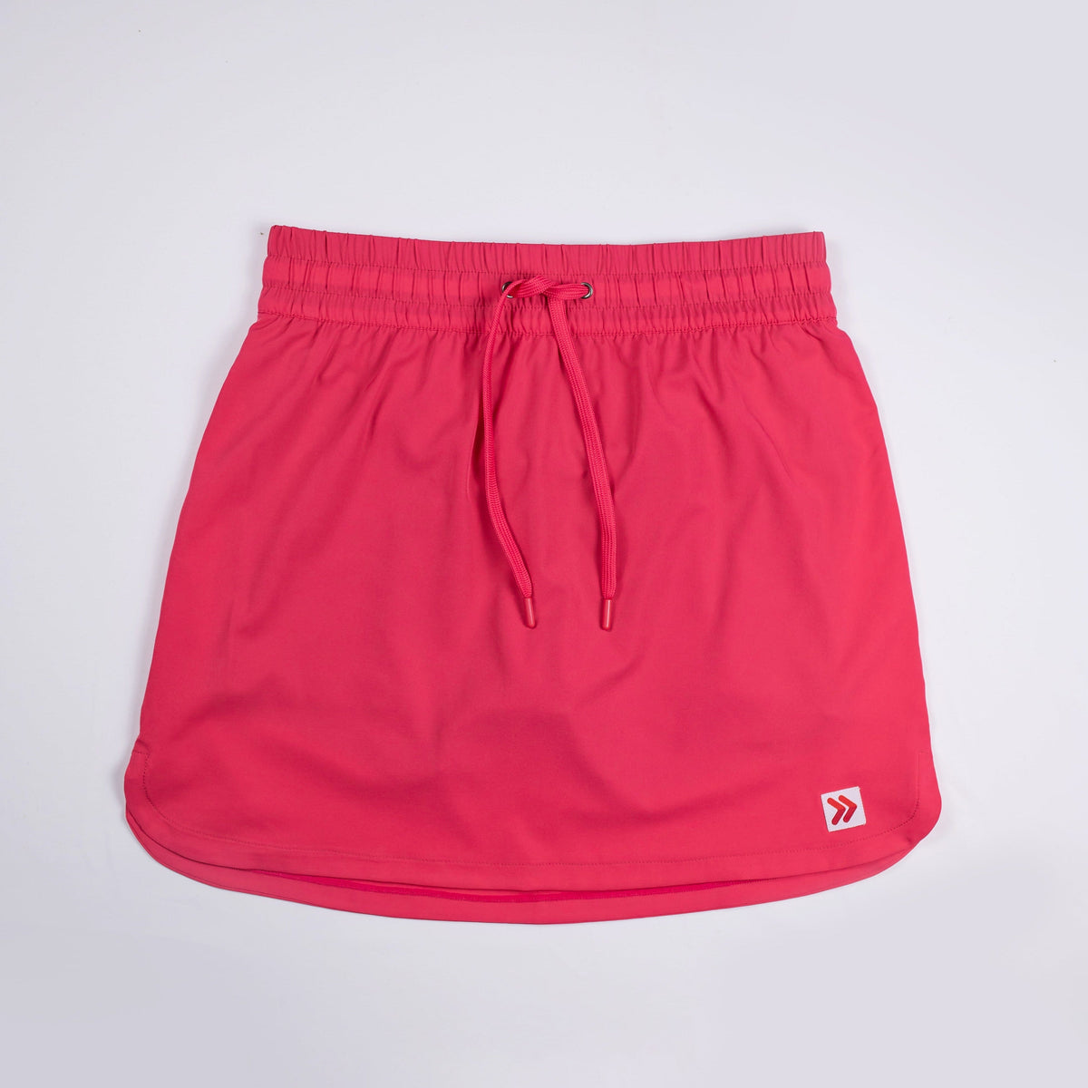 Front view of MOVE Sport Apparel women’s Skort in Paradise Pink with drawstring waist and original lower-hem tab.