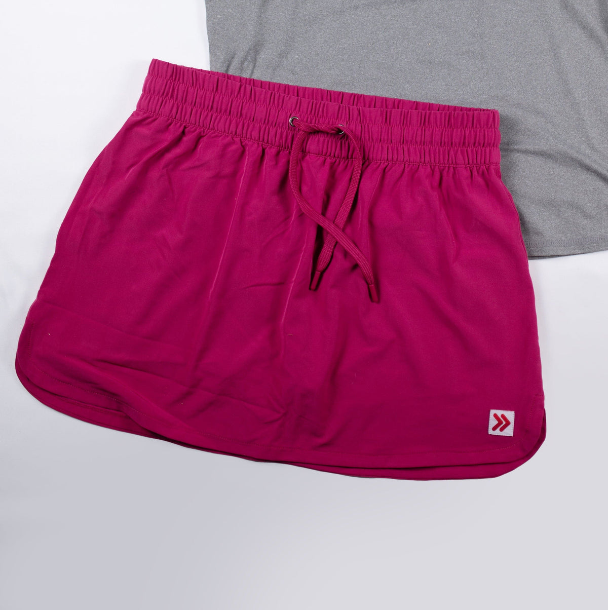 Front view of MOVE Sport Apparel women’s Skort in Vivacious pink.