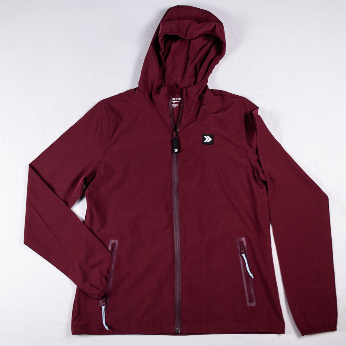 Windsor Wine MOVE Sport Apparel women’s Soft Shell Jacket, front view showing the hood, full zipper and two zippered side pockets.