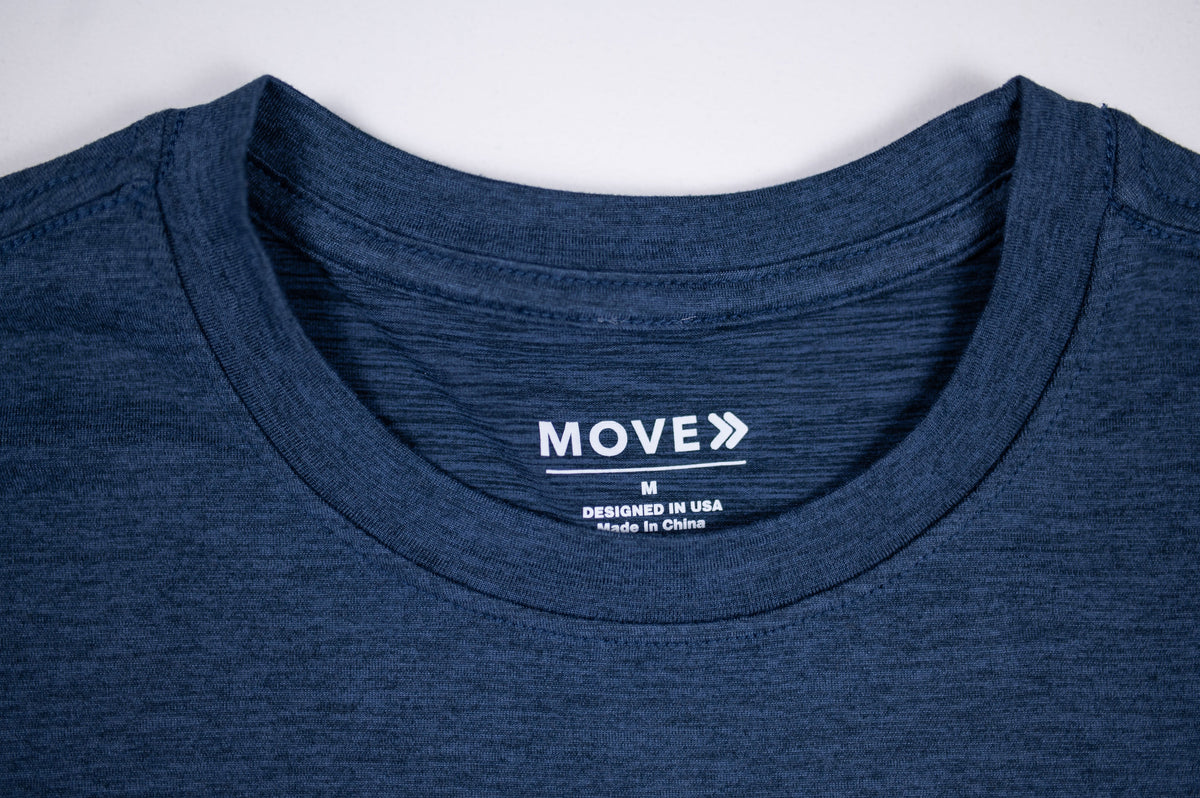 Pageant blue MOVE Sport Apparel women’s Essential Short Sleeve T-shirt showing its crew neckline, inside MOVE label and heathered fabric.