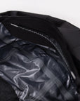 Close-up of the black MOVE Sport Apparel women’s waterproof jacket hood and gray interior lining.
