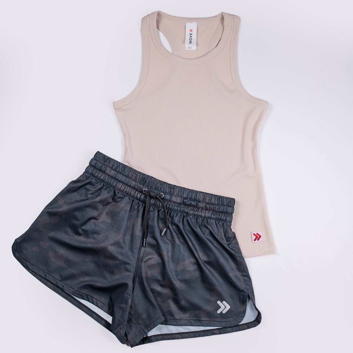 Crystal Gray MOVE Sport Apparel Women’s FlexRib Full Length Tank arranged with black running shorts.