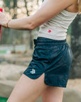 Side view of the Crystal Gray MOVE Sport Apparel Women’s FlexRib Full Length Tank worn with dark running shorts.