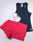 India Ink MOVE Sport Apparel Women’s FlexRib Full Length Tank arranged with red running shorts and a white cap.