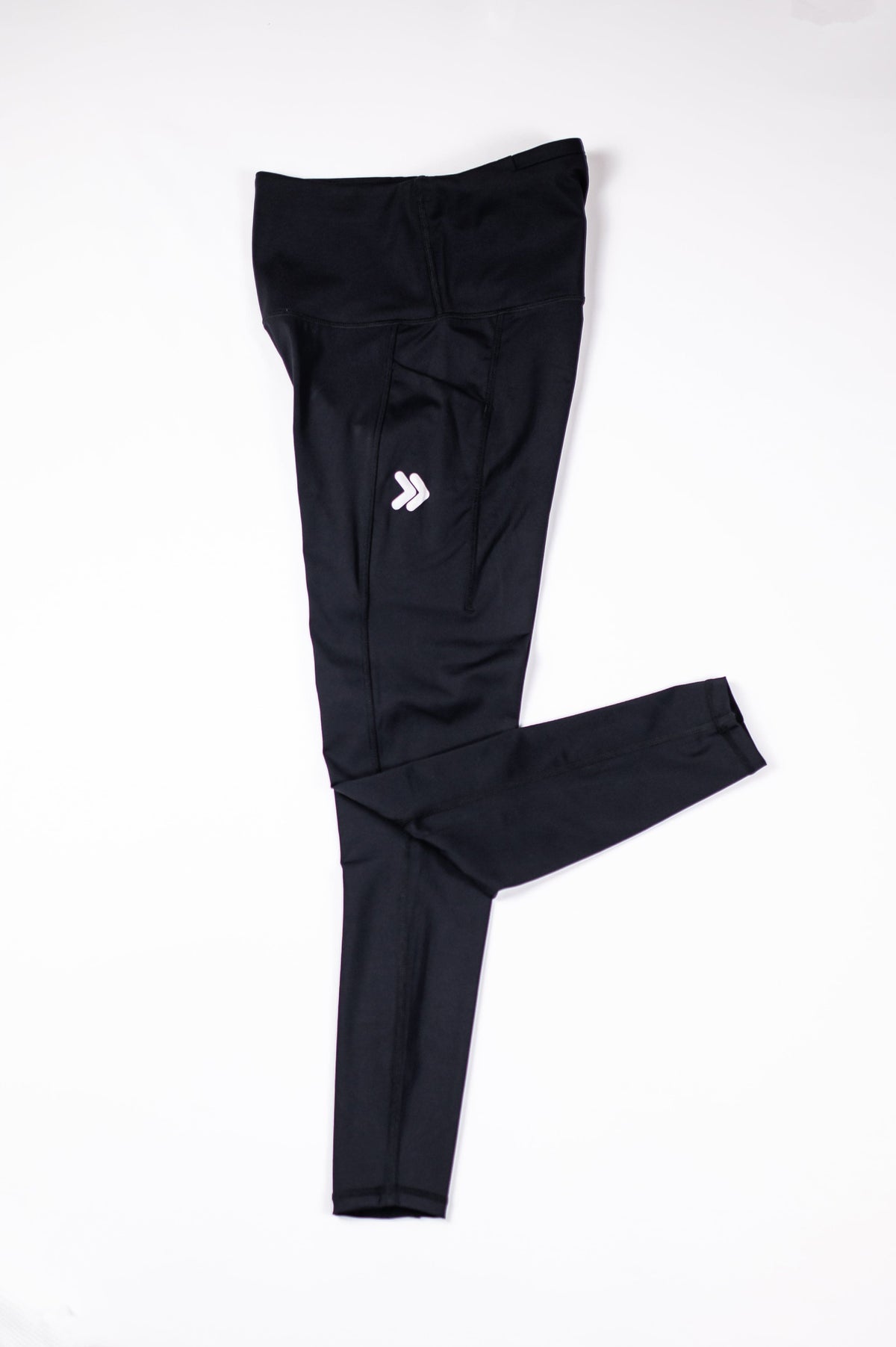 MOVE Sport Apparel women’s 25-Inch Running Tights: Black tights arranged with one leg folded.