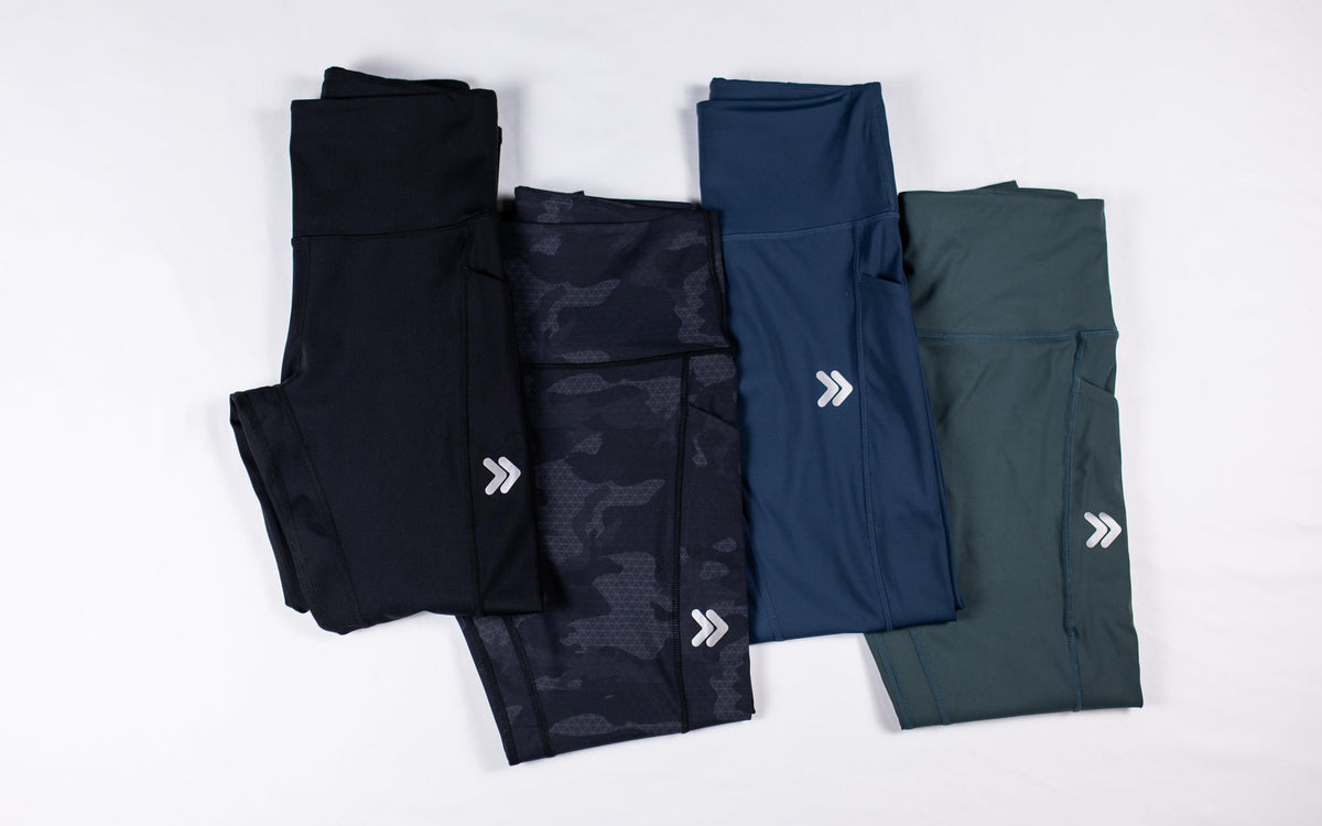 MOVE Sport Apparel women’s 25-Inch Running Tights: Black, Black Camouflage, Pageant blue and Balsam Green color options arranged together.