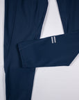 MOVE Sport Apparel women’s 25-Inch Running Tights: Close view of the original paired ankle bars on Pageant blue tights.