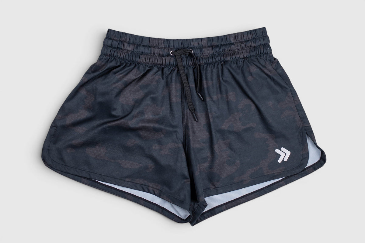 Front view of MOVE Sport Apparel women’s running shorts in Black Camouflage.