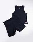 MOVE Sport Apparel women’s Biker Shorts: Black biker shorts arranged with a matching black cropped tank in a flat lay.
