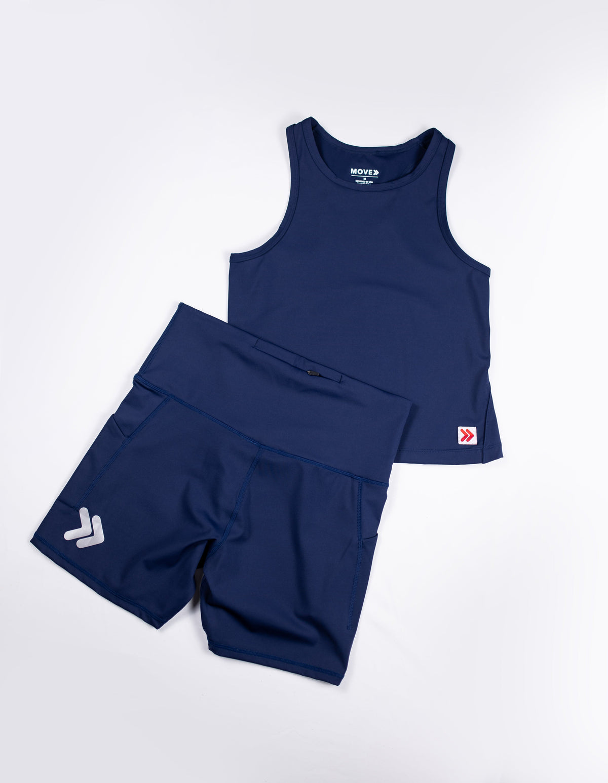 MOVE Sport Apparel women’s Biker Shorts: Maritime Blue biker shorts arranged with a matching cropped tank.