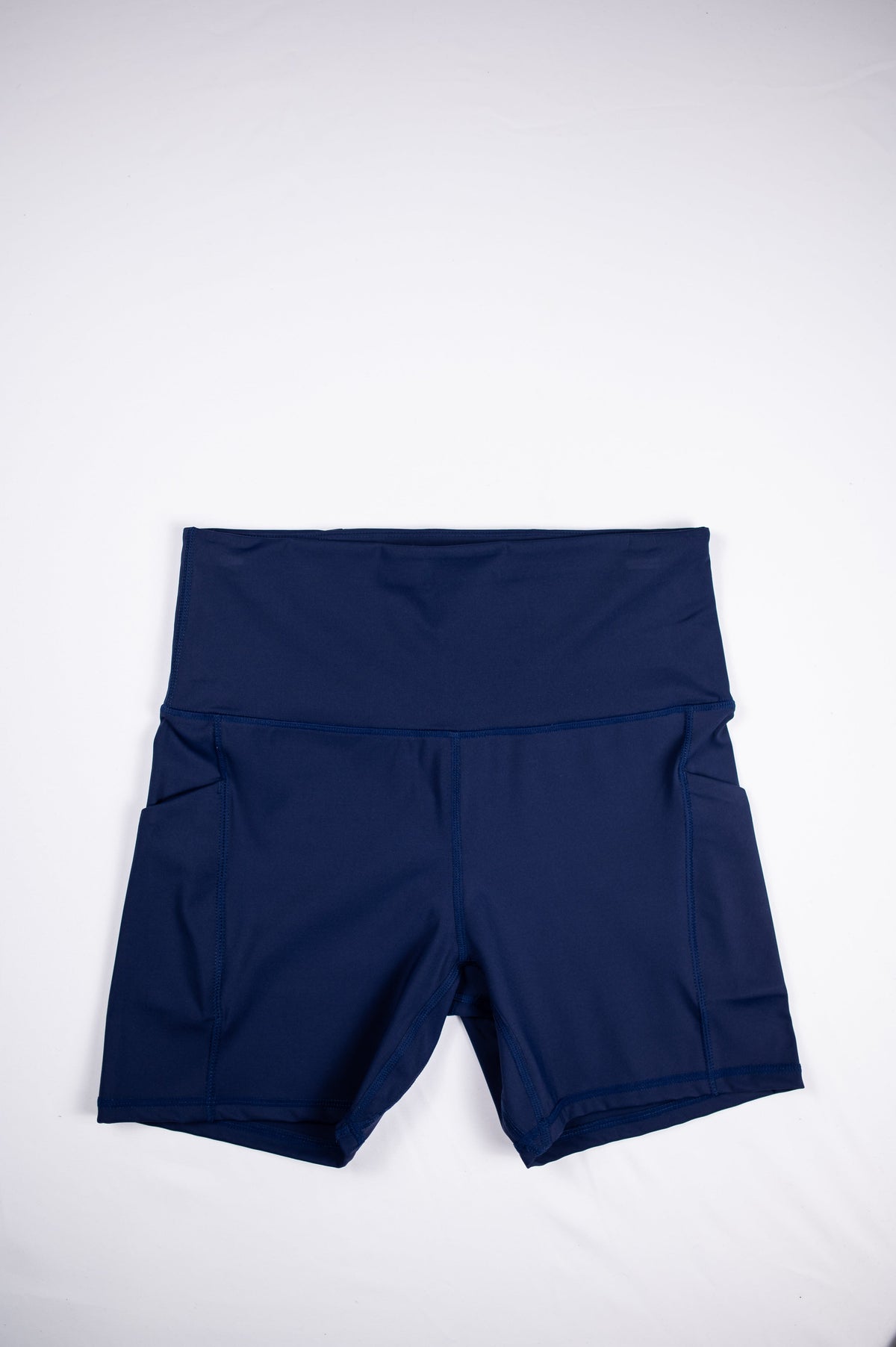 Maritime Blue MOVE Sport Apparel Women’s Biker Shorts shown flat from the plain side.