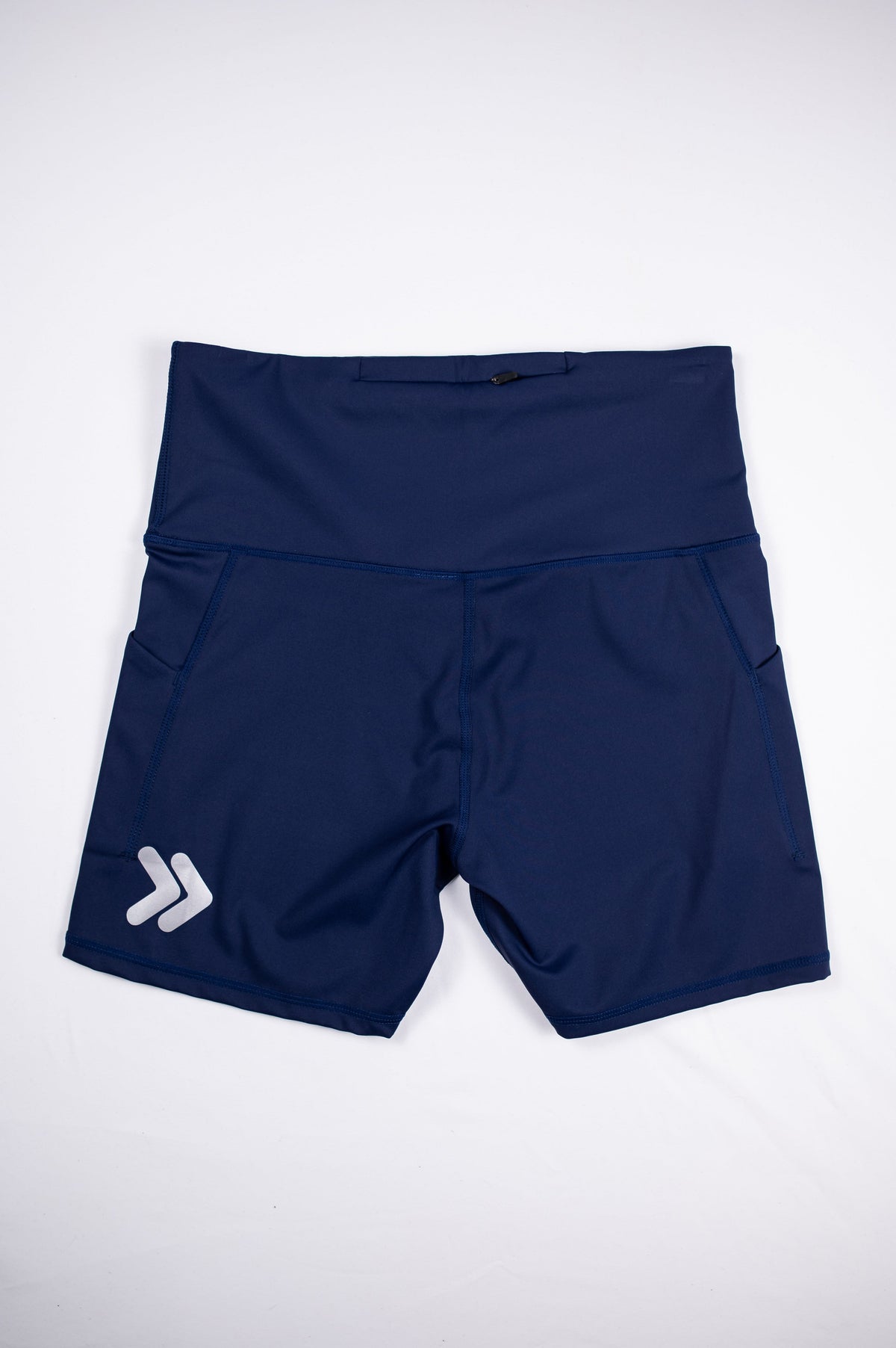 Maritime Blue MOVE Sport Apparel Women’s Biker Shorts shown flat with their original silver chevrons near the hem.