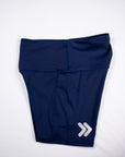 Maritime Blue MOVE Sport Apparel Women’s Biker Shorts folded to show the original silver embellishment near the hem.