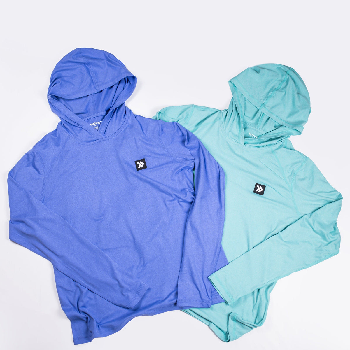 MOVE Sport Apparel women’s Black Label Lightweight Sun Hoodie: Deep Periwinkle and Aqua Splash sun hoodies arranged together.