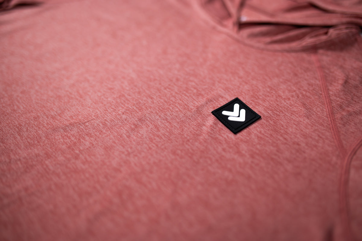 MOVE Sport Apparel women’s Black Label Lightweight Sun Hoodie: Close view of the original chest patch on the Desert Sand sun hoodie.
