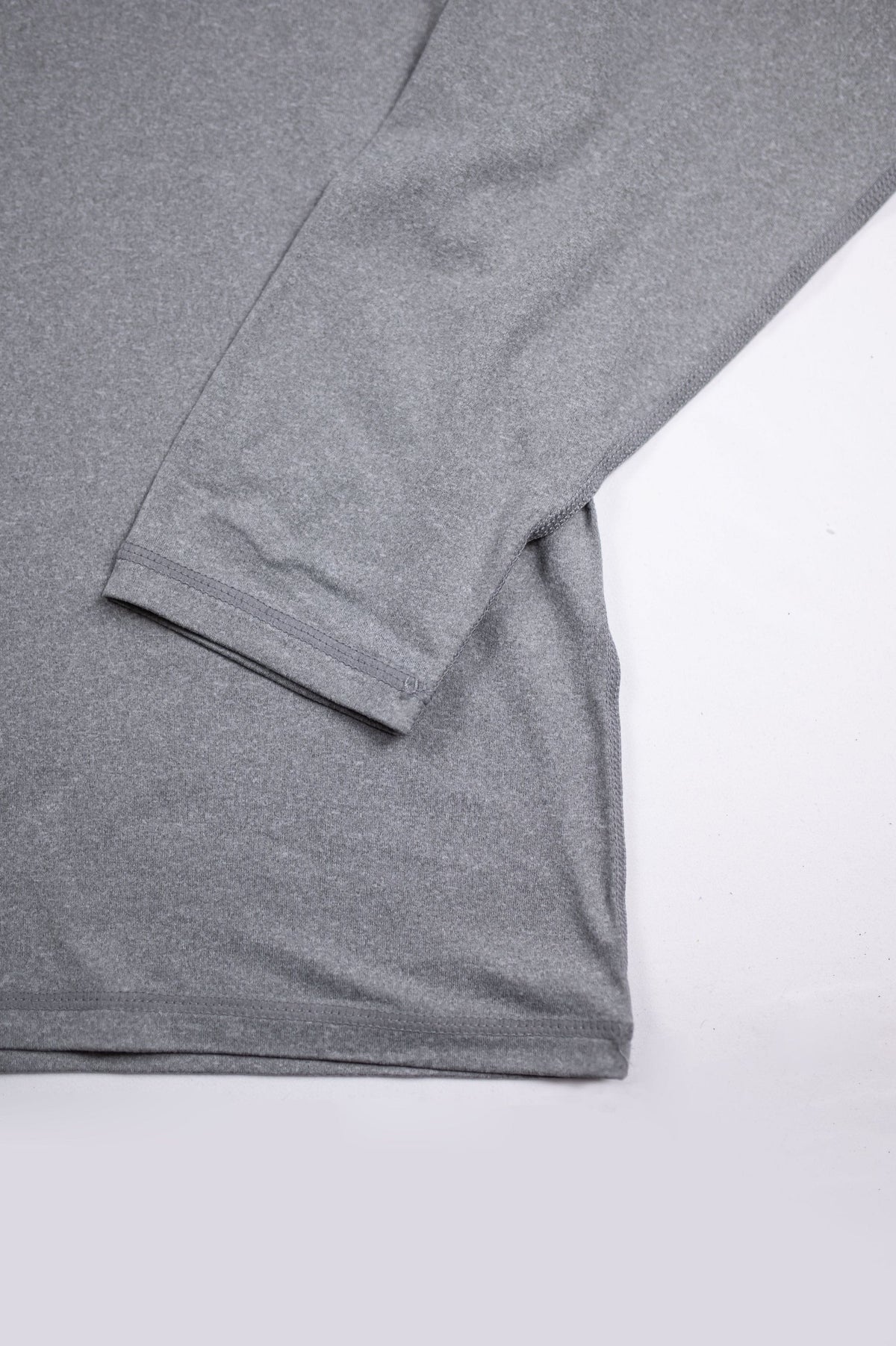 MOVE Sport Apparel women’s Black Label Lightweight Sun Hoodie: Close view of Heather Classic Gray sleeve cuff and hem seams.