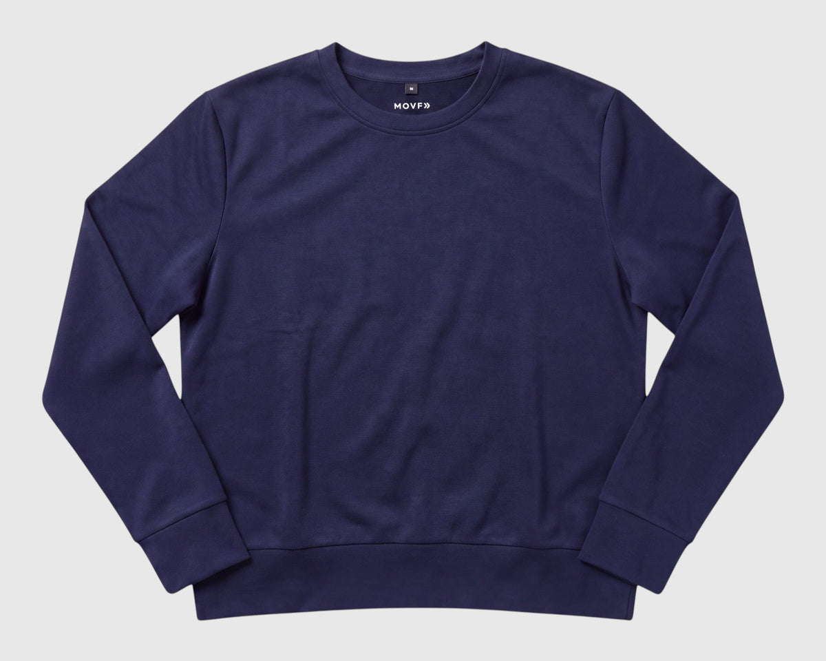 MOVE Sport Apparel Women’s Long Sleeve Crewneck Pullover in Naval Academy laid flat, showing its crew neckline and ribbed cuffs and hem.