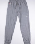 Front view of MOVE Sport Apparel women’s Essential Joggers in Grey, showing drawstring waist, pockets and ankle cuffs.