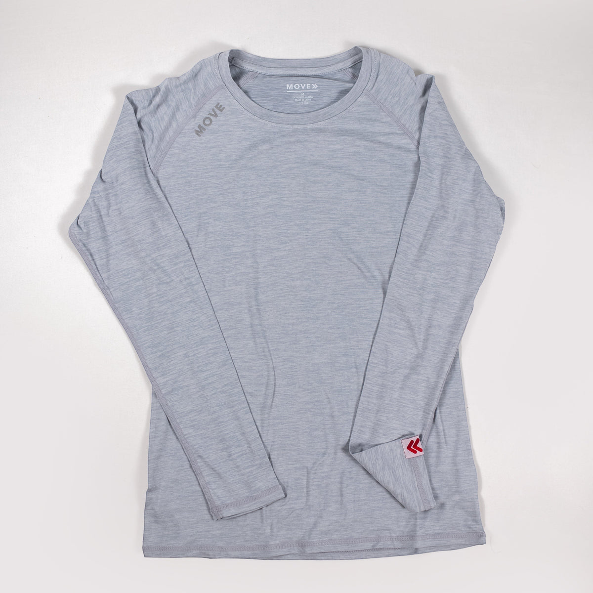 MOVE Sport Apparel Women’s Essential Long Sleeve in Silver Cloud laid flat.