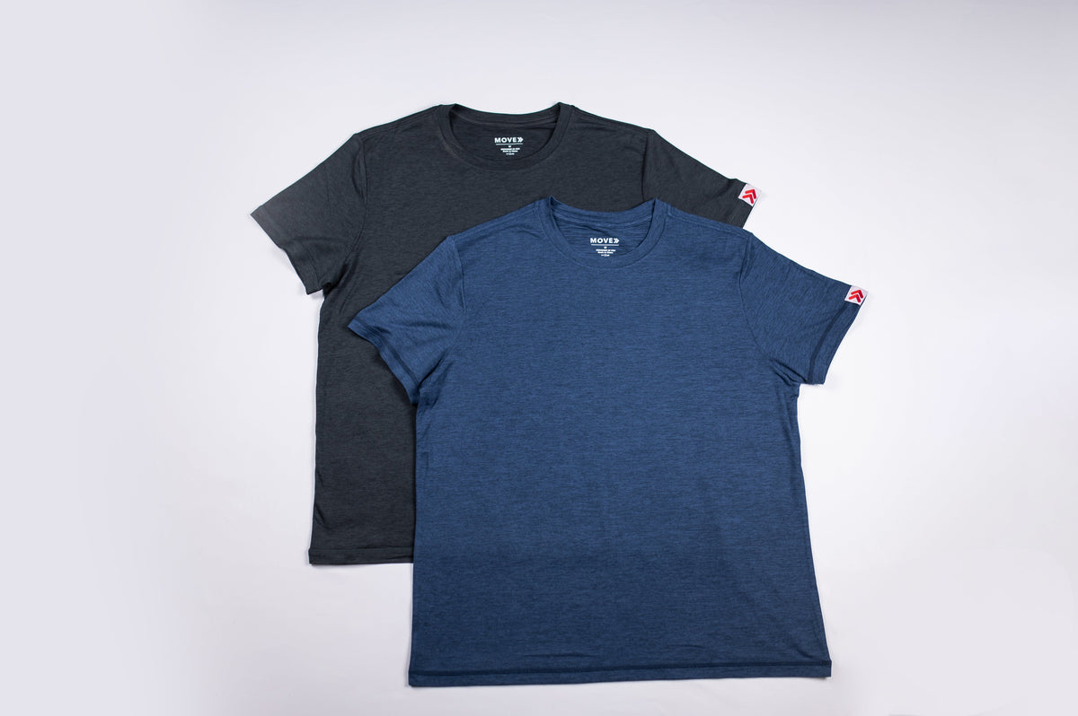 Flat lay of Pageant blue and Heather Black MOVE Sport Apparel women’s Essential Short Sleeve T-shirts showing their full front shapes and sleeve tags.