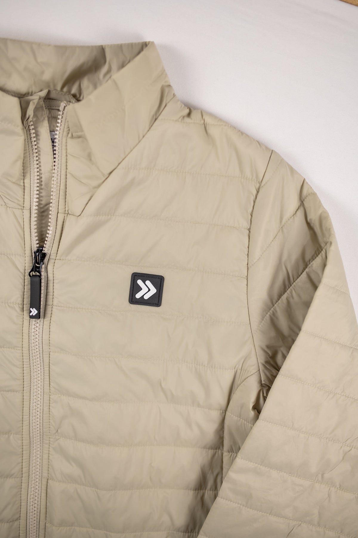 Detail of the original white chevron embellishment on the black chest patch of the Silver Birch jacket.