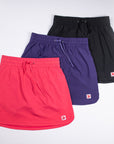 MOVE Sport Apparel women’s Skorts in pink, purple and black arranged together.