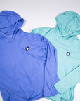 MOVE Sport Apparel women’s Black Label Lightweight Sun Hoodie: Deep Periwinkle and Aqua Splash hoodies shown with their original chest patches.