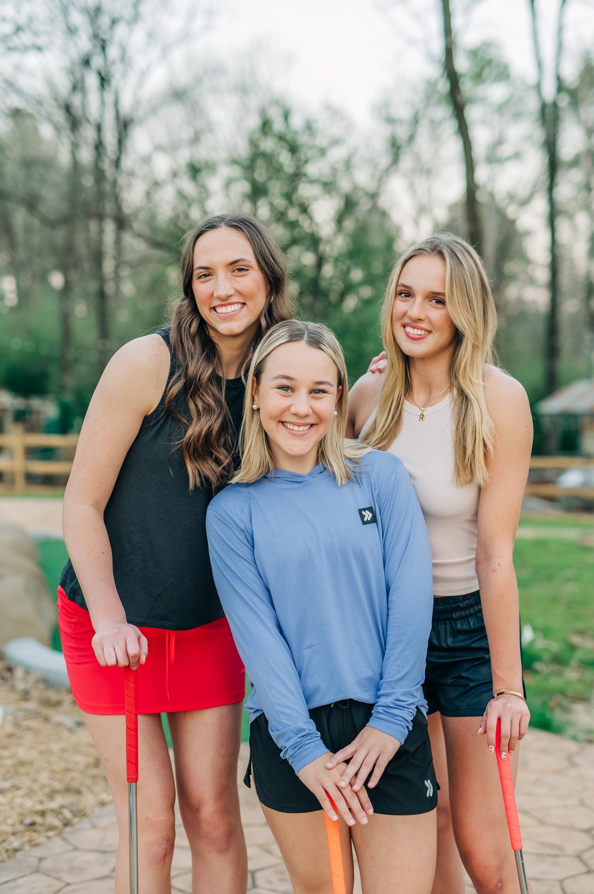 MOVE Sport Apparel women’s Black Label Lightweight Sun Hoodie: Woman wearing Deep Periwinkle sun hoodie in a portrait with friends outdoors.